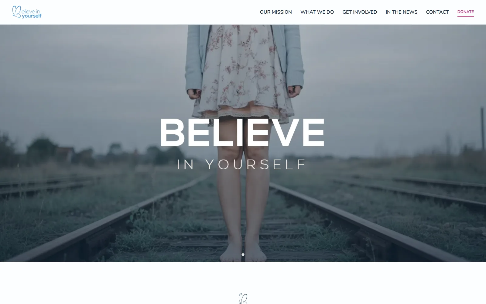 BelieveInYourself homepage: BELIEVE IN YOURSELF over a photo of a girl standing barefoot on train tracks